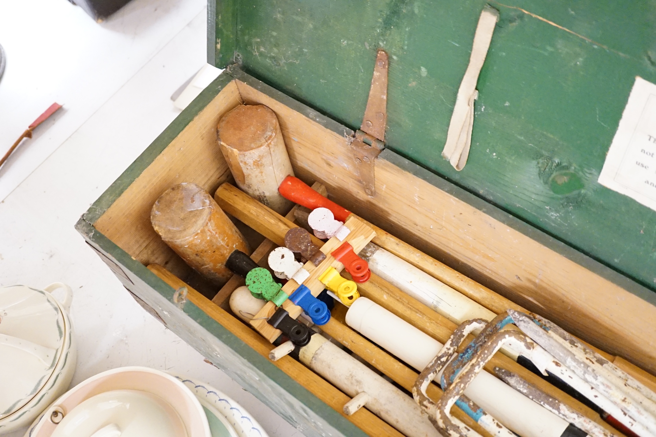 An early 20th century boxed croquet set